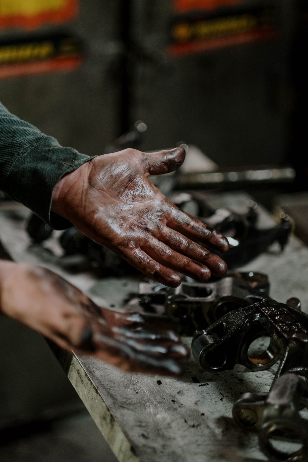 Mechanic's hand working at the repair bench