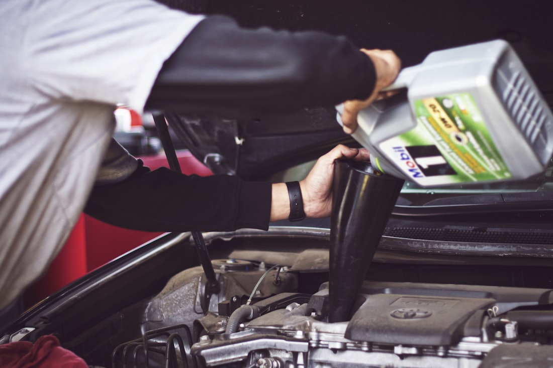 Refilling motor oil in an engine bay